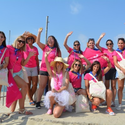 Group of girls having a bachelor party in Barcelona, dressing pink shirts