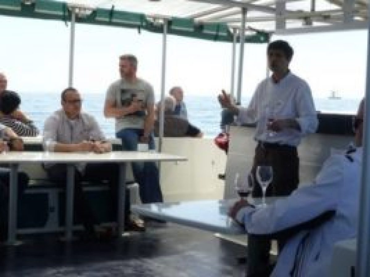 people drinking on the deck of a ship