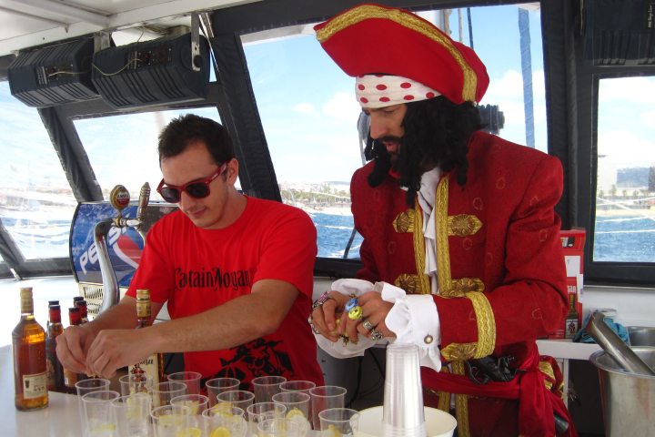 a man and a woman sitting at a table with a cake